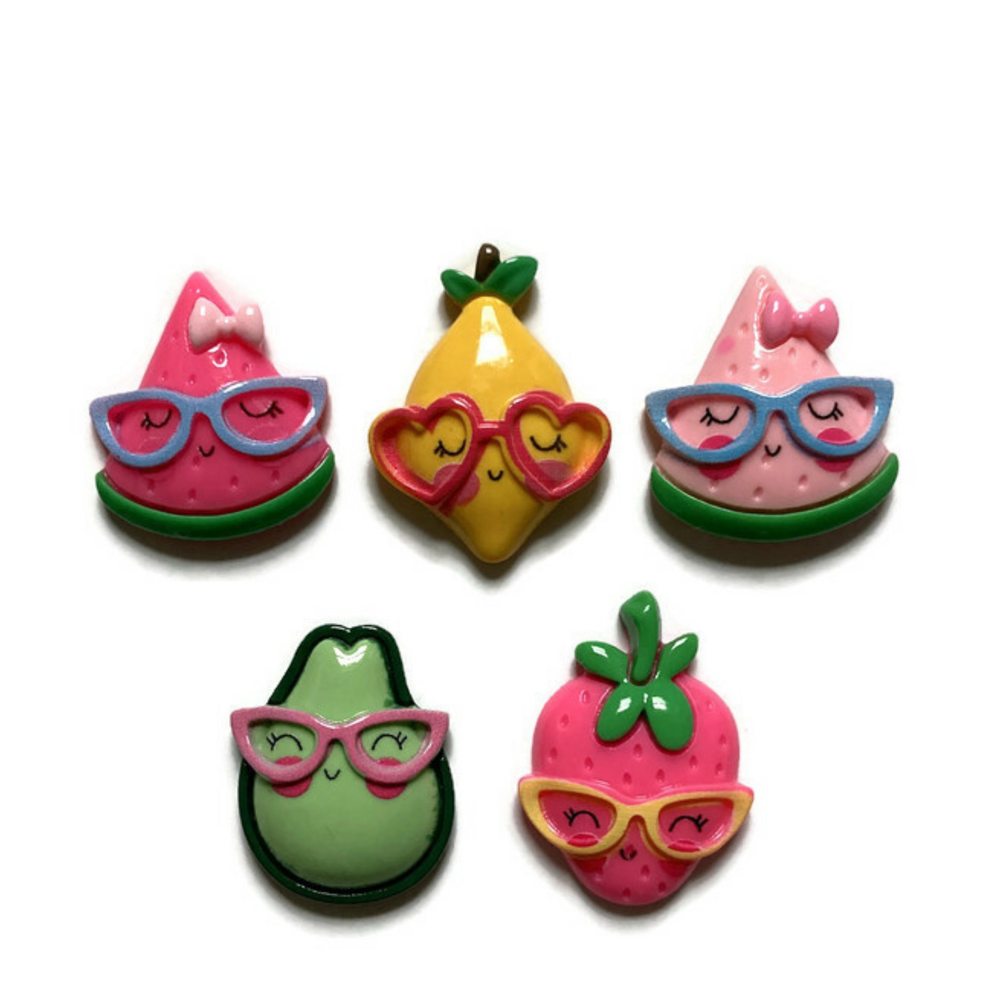Five large fruit magnets on white background, including dark pink watermelon, yellow lemon, light pink watermelon, green avocado, and dark pink strawberry. All fruit are wearing eyeglasses.