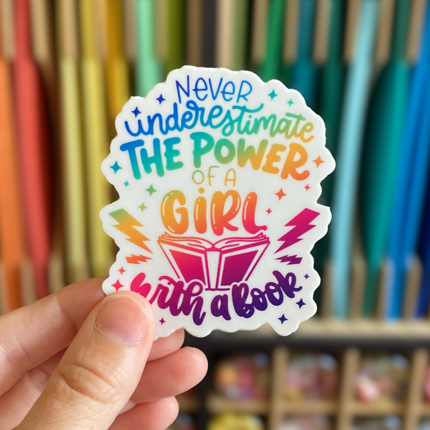 Never Underestimate The Power Of A Girl With A Book Sticker