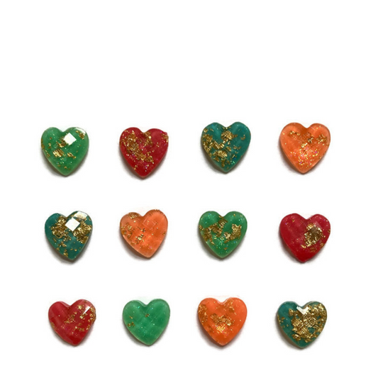 Twelve mini heart magnets on white background. Three each of aqua, pink, turquoise, and orange. Hearts feature gold flecks.
